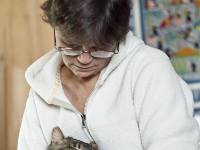 Lisa holding Hermes on bed P2 P2200038  Hermes sleeps...